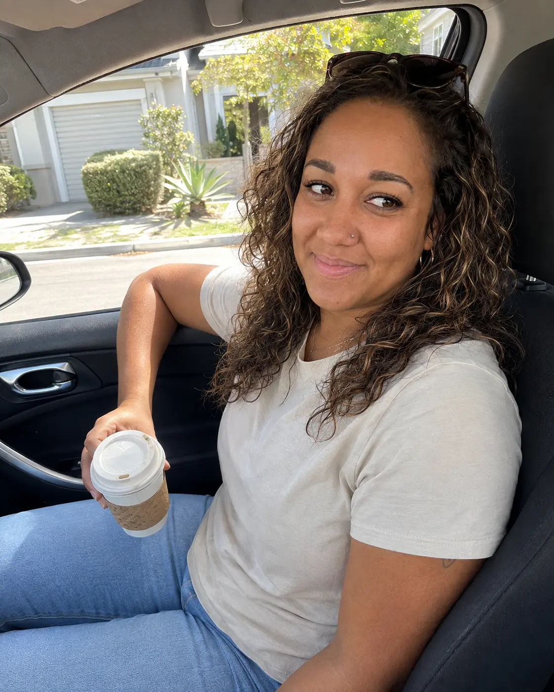 Erica Rivera smiling with coffee