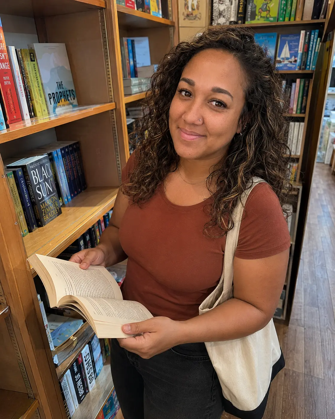 Erica Rivera browsing a bookstore shelf
