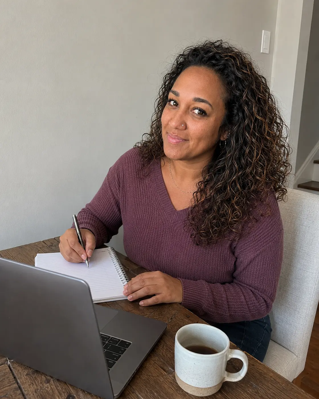 Erica Rivera working through notes beside her laptop